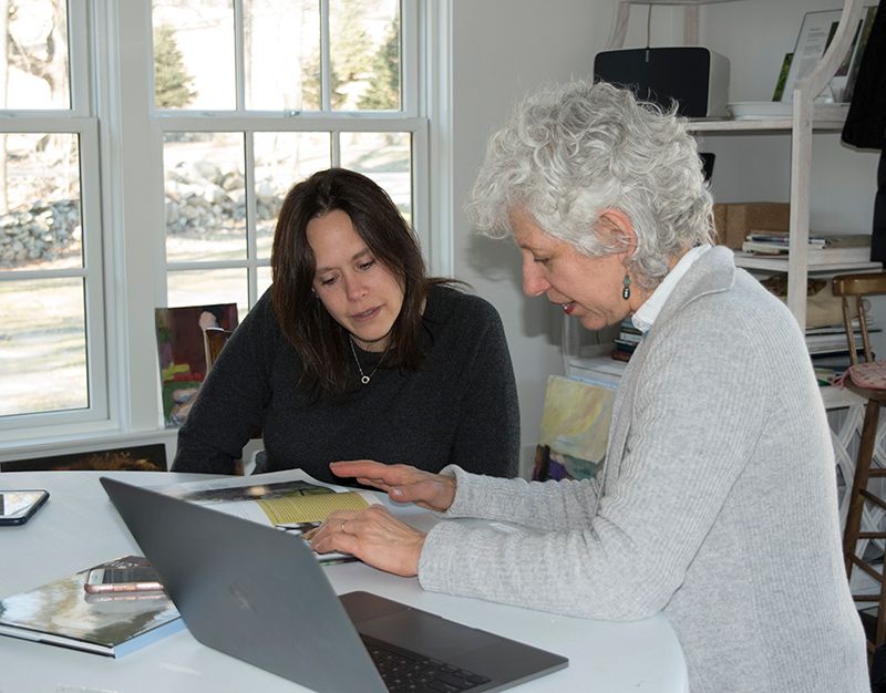 Kent shows Reneé of intoBirds one of the owl books she uses as inspiration for her paintings