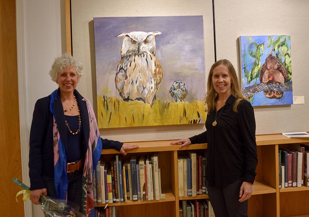 Karen Kent and Annamari Mikkola, lead curator for the New Canaan Library standing in front of 'Twins' and 'Mel'