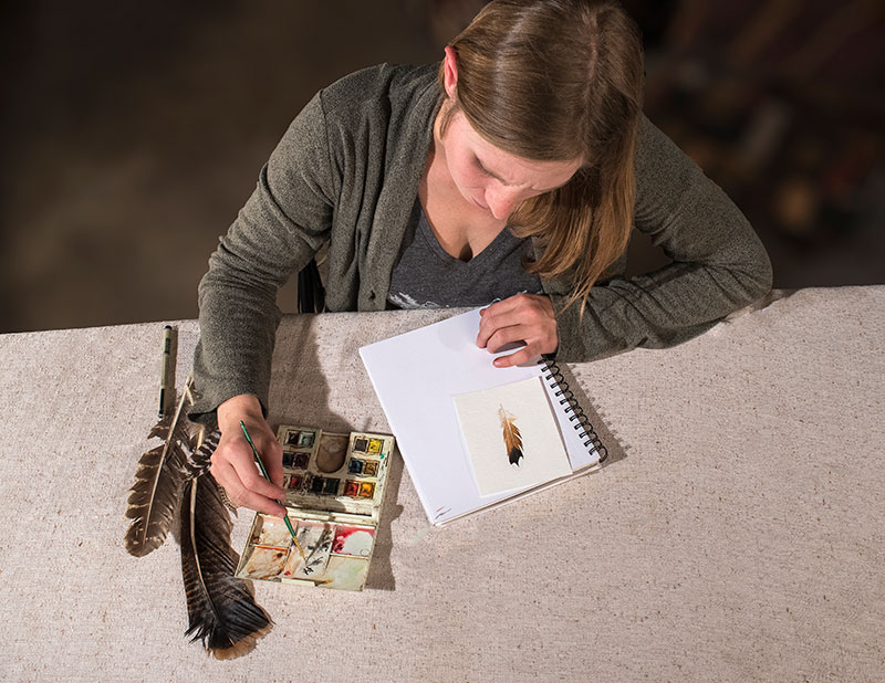 Katie says painting feathers for her is a meditative process