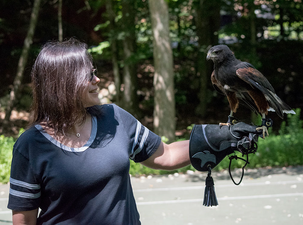Reneé of intoBirds holding Milo. The first time you hold a bird of prey it's intimidating realizing you're holding a fierce raptor on your arm